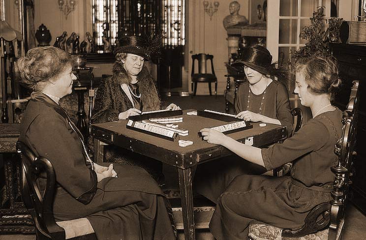 Women playing the traditional, Asian version of Mahjong